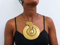 African Brass necklace, Brass jewelry, African jewelry for women, Tribal necklace, One size fits all, Christmas Gift for her, Moms gift The necklace is handcrafted using brass metal. Length: 9 inches Shipping fee is for the first item only, additional items ship for FREE. DHL Express shipping with 3-5 days delivery. To view our brass collection, click here: https://www.etsy.com/shop/NkoroiCrafts?ref=simple-shop-header-name&listing_id=1295061994&section_id=39639351 *Care instructions* Brass tarnishes with exposure to moisture and oxidation. To clean it, kindly use a lemon wedge. Squeeze the juice and polish along the surface with a clean cloth. Unique Pendant Choker As Gift, Brass Costume Jewelry As Gift, Brass Costume Jewelry For Gifts, Unique Brass Choker Jewelry, Unique Choker Necklace As Gift, Unique Choker Necklace For Gift, Adjustable Costume Jewelry Choker As Gift, Adjustable Costume Jewelry Choker For Gift, Metal Necklaces With Unique Designs