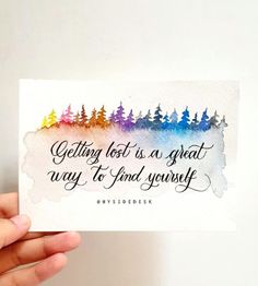 someone holding up a card that says, getting lost is as great way to find yourself