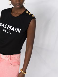 Find BALMAIN Button-detailed T-shirt on Editorialist. black cotton jersey decorative button detailing logo print at the chest crew neck sleeveless Summer Tops With Logo Detail, Black Crew Neck T-shirt With Button Closure, Designer Black Sleeveless Top, Designer Black Tops With Button Closure, Designer Black Tops With Logo, Designer Black Tops With Buttons, Balmain Shirt, Detailing Logo, Balmain Paris