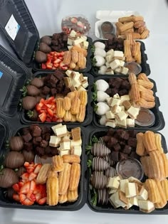 several trays filled with different types of food