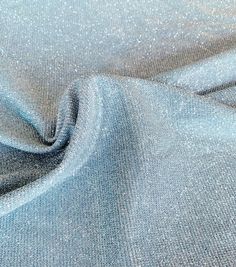 a blue fabric with silver glitter on it