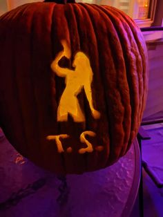 a pumpkin carved to look like a man and woman