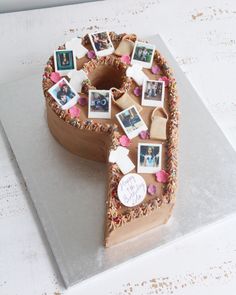 a cake shaped like the letter p with pictures on it