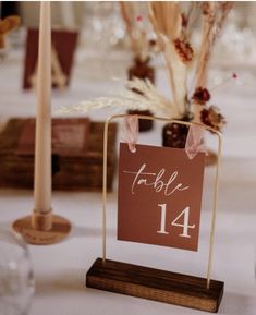 the table numbers are displayed on wooden stands