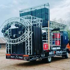 a large truck with a stage on the back