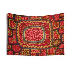 a red and green tapestry with an intricate design on it's center square shape