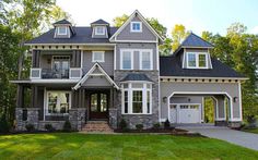 a large gray house with lots of windows