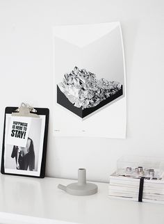 a white desk with a black and white photo on it