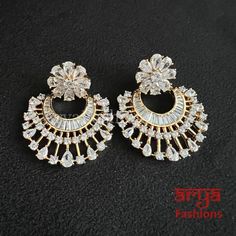 Kiara CZ Cocktail Chandbali Earrings Party/Trendy/Silver Cubic Zirconia Earrings/Ethnic earrings/American Diamond Earrings 1-Made in Brass in 22 karat gold plating 2-Length: 2.5 Inches 3- Made with very high quality Cubic Zirconia Stones 4- Lightweight Jewelry 5- Suitable for any traditional or contemporary occasion 6-Very Elegant and stylish, suitable for any attire. 7- Comes with push back closure American Diamond Earrings, Chandbali Earrings, Light Weight Jewelry, Ethnic Earrings, Cubic Zirconia Earrings, Zirconia Earrings, American Diamond, Gold Plating, Statement Earrings