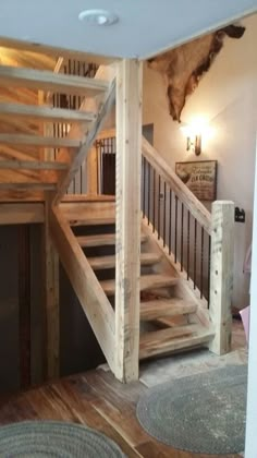 there is a wooden staircase in the living room