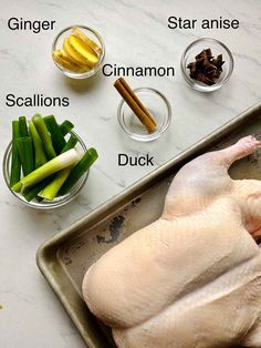 the ingredients needed to roast a chicken on a baking sheet