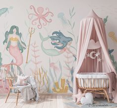 a child's room with mermaid themed wallpaper and pink canopy bed in the corner