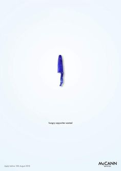 a blue object is in the middle of a white background with an inscription below it