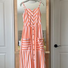 Nwt Stripe Dress. Light Weight Fabric. Soft Orange And White Stripes. Pockets. Button All The Way Down. Was Too Long For Me. I’m 5’1 Casual White Maxi Dress With Buttons, Summer White Midi Dress With Button Closure, White Button-up Maxi Dress For Summer, Summer Maxi Dress With Buttons For Daywear, Summer Maxi Dress With Button Closure For Day Out, White Sleeveless Sundress With Button Closure, Casual White Maxi Dress With Button Closure, Spring Beach Sundress With Buttons, White Button-up Maxi Dress For Vacation