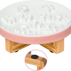 a large white tray with lots of ice cubes on it and a wooden base