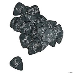 some black guitar picks with writing on them