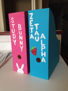 two cardboard boxes with the words bunny and strawberry on them are sitting on a table