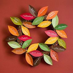 the front cover of a book with colorful leaves on it