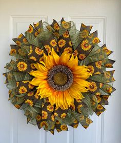 a sunflower is hanging on the front door