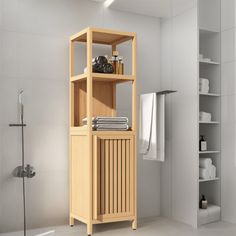 a bathroom with a wooden cabinet next to a walk in shower