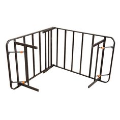 an open metal gate with two orange handles