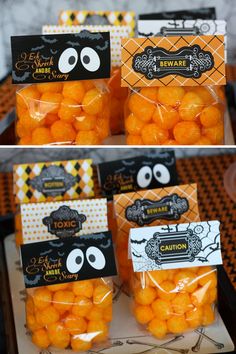 halloween treat bags filled with candies in oranges and black on the inside are candy eyes