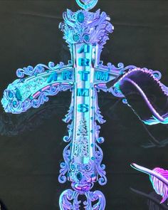 an illuminated cross is shown in the dark