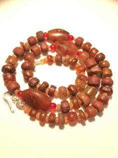 A beautiful collection of very old ancient Carnelian Beads , Carnelian Beads, . They are found in Afghanistan, India, Pakistan and Tibet. They can be used to make a beautiful contemporary designed necklaces. Each bead is authentic and old. Highly collectible 9 pictures are there you can swipe each to see all pictures silver lock 95.5with the necklace Artisan Carnelian Beaded Necklaces, Artisan Amber Beads Hand-strung, Handmade Carnelian Beads For Jewelry Making, Spiritual Brown Natural Stones Beads And Cabochons, Spiritual Brown Beads, Gems, And Cabochons With Natural Stones, Brown Carnelian Beaded Jewelry, Unique Amber Carnelian Beaded Necklaces, Handmade Amber Carnelian Beaded Necklaces, Unique Brown Gemstone Beaded Necklaces