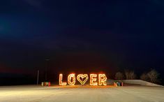 the word lover spelled out in neon lights