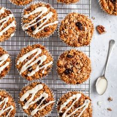 muffins with white icing on a cooling rack