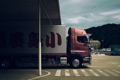 a red truck parked in front of a building