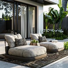 an outdoor living room with couches and plants