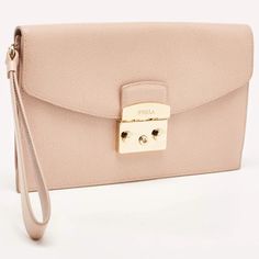 description: Elevate your attire with our Furla clutch for women. Crafted with exquisite detail, it combines luxurious materials and a timeless design, making it a wonderful accessory..gender: Women.includes: Original Dustbag.Length: 25 cm.Width: 1.5 cm.Height: 15 cm.Hardware: Gold Tone.Exterior Material: Leather.Interior Material: Fabric.Origin: China.Condition:.Good.Overall in good condition with minor darkening on lining flap, scratches on metal. Elegant Everyday Envelope Bag, Elegant Envelope Bag, Luxury Handheld Clutch For Daily Use, Luxury Handheld Clutch With Removable Pouch, Elegant Envelope Shoulder Bag For Daily Use, Luxury Clutch With Detachable Handle For Daily Use, Classic Clutch With Fold Over Clasp For Daily Use, Elegant Handheld Wallets For Daily Use, Elegant Handheld Wallet For Daily Use