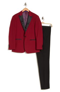 Bring understated elegance to the table in this three-piece tuxedo crafted from rich fabric in a classic single-breasted silhouette. Jacket has shawl collar; chest welt pocket; front welt pockets Vest has front button closure; V-neck Pants have zip fly with button closure; front slant pockets; back button-welt pockets Jacket and vest are lined; trousers are lined to the knee 65% polyester, 35% viscose Dry clean Imported Each suit has a 6” drop, meaning that a size 38R jacket is paired with size Formal Tuxedo Sets With Slim Fit, Classic Slim Fit Winter Sets, Fitted Tuxedo Sets For Formal Occasions, Classic Fitted Formal Sets, Classic Slim Fit Sets For Winter, Classic Fitted Sets For Formal Occasions, Classic Fitted Evening Sets, Elegant Holiday Suits, Formal Fitted Suiting Fabric Sets