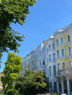 a row of white and yellow buildings next to each other