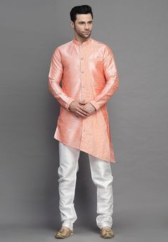 Art Silk Kurta in Peach. This Readymade attire is Enhanced with Buttons. Crafted in Chinese Collar Neck and Full Sleeve. Available with an Art Silk Churidar in Off White. Do note: Footwear shown in the image is for presentation purposes only. Half to one inch may vary in measurement. (Slight variation in actual color vs. image is possible). We sell all kinds of menswear. Mens Kurta | Mens Kurta Pajama | Mens Sherwani | Mens Sherwani Sets | Traditional Menswear | Partywear Menswear | Indian Mens Fitted Orange Kurta For Summer, Long Sleeve Peach Kurta For Festive Occasions, Peach Long Sleeve Kurta For Festive Occasion, Orange Long Sleeve Kurta For Spring, Spring Festive Orange Kurta, Spring Wedding Peach Kurta, Peach Long Sleeve Sets For Spring, Menswear Indian, Mens Kurta Pajama