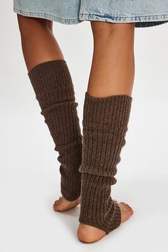 Sure to be the coolest addition to your accessories collection, these totally timeless legwarmers are featured in a sleek, ribbed knit fabrication and toe-less, heel-less style for the perfect wear-anywhere style. | Ribbed Stirrup Legwarmers by Hansel From Basel at Free People in Brown Fitted Ribbed Leg Warmers For Spring, Ribbed Stretch Footless Leg Warmers, Stretch Ribbed Footless Leg Warmers, Trendy Fitted Solid Leg Warmers, Trendy Fitted Solid Color Leg Warmers, Stretch Knee-high Ribbed Leg Warmers, Fitted Knit Leg Warmers For Fall, Spring Stretch Ribbed Leg Warmers, One Size Footless Ribbed Leg Warmers