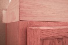 a close up view of wood grain on the side of a wooden cabinet door,