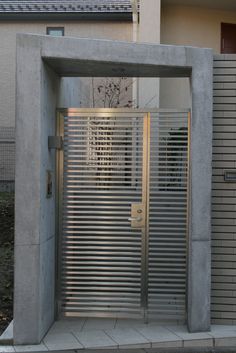 an entrance to a building with metal slats