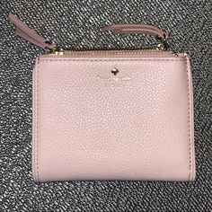 Basically Brand New Kate Spade Bi-Fold Wallet With Two Coin Pockets. Has Three Pockets On Each Side For Credit Cards. Color Is Light Pink Blush. Measurements: 8” Long (4” When Folded) X 4” Wide Kate Spade Bifold Coin Purse, Blush Rectangular Wallet With Card Slots, Compact Kate Spade Wallet, Chic Blush Wallet For Everyday Use, Chic Blush Wallets For Everyday Use, Kate Spade Pink Wallet For Everyday Use, Compact Kate Spade Coin Purse, Elegant Kate Spade Coin Purse For Everyday Use, Kate Spade Pink Bifold Wallet