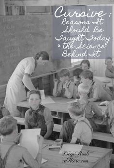 an old black and white photo of children at desks with teacher in the background