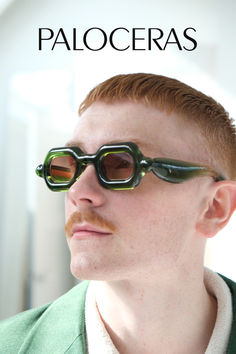 Close-up image of a man wearing distinctive Pistachio Green sunglasses with a chunky square shape and vintage-inspired design. The frames are bold and expressive, offering a standout accessory for those with eclectic taste. Elements Drawing, Pebble Collection, Funky Glasses, Colourful Design, Pistachio Green, Luxury Eyewear, Jewelry Fashion Trends, Designer Eyewear, Eye Wear Glasses