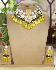 Sabyasachi inspired Kundan Polki Choker necklace of Beads with matching earrings Perfect for any kind of occasions and ceremonies. You can wear it with Saree lehenga and Evening Gowns. Highest quality and craftsmanship. Arrives in box Please let me know if you have any questions Designer Kundan Necklace For Weddings And Festivals, Designer Chandbali Wedding Jewelry, Designer Multicolor Jewelry For Weddings, Traditional Yellow Necklaces For Weddings, Designer Wedding Necklaces For Festive Occasions, Yellow Cutdana Jewelry For Wedding, Traditional Yellow Necklace For Wedding, Designer Festive Wedding Necklaces, Designer Jewelry For Weddings And Festivals