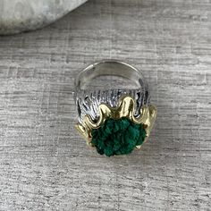 Natural malachite ring in sterling silver and gold. It is gold plated around the stone. This ring is the perfect gift for unique and modern girls and women. All our jewelry is made of high-quality sterling silver and is stamped with a 925 stamp 【FULL DETAILS】 Gemstone: Natural raw malachite SIZE: any size available (choose from the option) WEIGHT: approx. 15 gr (0.03pounds) Stone Diameters: 16 mm (0.62 inches) The height from the finger: 12 mm (0.47 inches) ⦿ Attention: The color of the stones m Gold Sterling Silver Rings With Natural Stones, Gold Emerald Ring With Gemstone In Sterling Silver, Brass Ring With Natural Stones, Spiritual Gold Emerald Ring With Gemstone, Spiritual Gold Emerald Ring, Gold Emerald Ring With Spiritual Style, Gold Emerald Ring With Natural Stones For Anniversary, Silver Malachite Gemstone Ring, Malachite Rings As Gifts