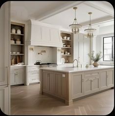 a large kitchen with an island in the middle and lots of cabinets on both sides