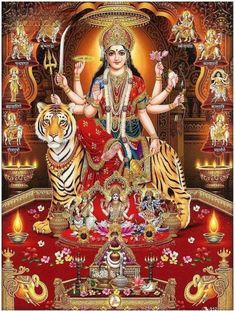 the hindu goddess sitting on top of a tiger