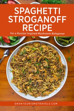 spaghetti with mushrooms and other vegetables on a wooden table in front of the title, spaghetti stroganoofff recipe for a russian inspired mushroom bologian