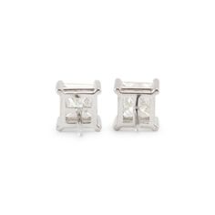 Metal Type: 14K White Gold  Width: 6.65 mm  Weight:1.79 grams  14K White Gold diamond stud earrings with push backs. The metal was tested and determined to be 14K white gold. Engraved with "14K". In excellent condition.  Pre-owned. Might show minor signs of wear.  4-Prong Set in 14 Karat White Gold with:  Two (2) princess cut natural diamonds:  Measurements: 5.18mm x 5.48mm x ~3.84mm in depth. Weight Range: 0.858 ct. - 0.915 ct. Total Carat Weight: 2.20 ct. Color: L - M Clarity: I2 Polish: Very Good Symmetry: Very Good  TOTAL WEIGHTS:  Total weight of diamond(s): 2.20 ctw. White Gold Baguette Cut Earrings With Prong Setting, Classic White Gold Channel Set Earrings, Silver Baguette Cut Diamond Earrings With Prong Setting, Classic White Gold Baguette Cut Earrings, Silver Baguette Cut Platinum Earrings, Silver Platinum Baguette Cut Earrings, Silver Baguette Cut Earrings With Prong Setting, Silver Earrings With Baguette Cut In Prong Setting, Formal White Earrings With Channel Set