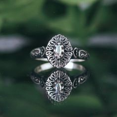 A unique Shop Dixi sterling silver gothic stacking ring. Featuring an enchanting mystic cubic zirconia centre in filigree detailing, she's a true unique ring for your boho jewelry collection MaterialSterling SilverCubic Zirconia SizingRing Sizes Available - 15.75mm [USA 5]. 18.25mm [USA SIZE 8]Ring Front - Height 10mm Witchy Ring, Gothic Ring, Gothic Rings, Midi Rings, Cubic Zirconia Rings, Unique Ring, Boho Ring, Stacking Ring, Perfect Ring