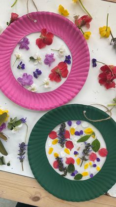 two paper plates with flowers on them